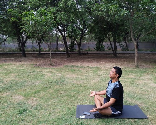 serene man practicing mindfulness outdoors